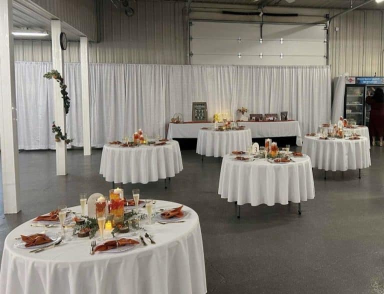 A reception with round tables and a head table